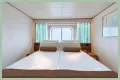 An old Holland America cruise ship is turning residential, letting travelers live at sea for $8,000 a month while it circumnavigates the globe
